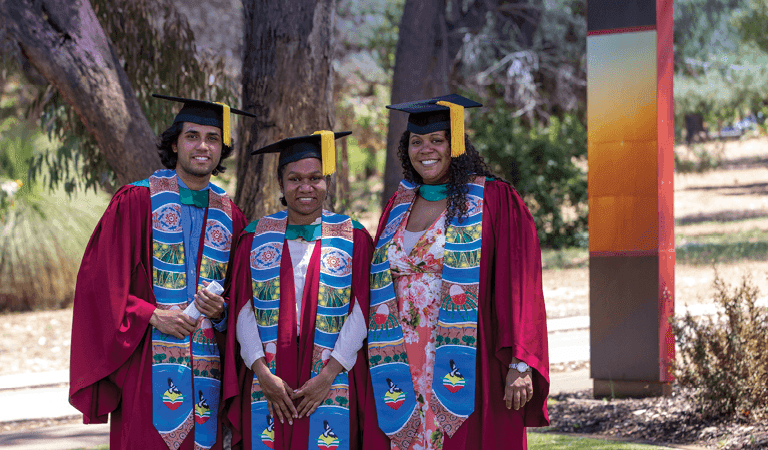 University graduates posing for a photo