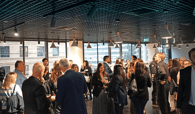 people congregating in a breakout area